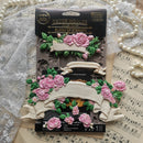 Prima Bloom of Eternity floral banner silicone mold shown with pink rose castings, lace, pearls and vintage sheet music