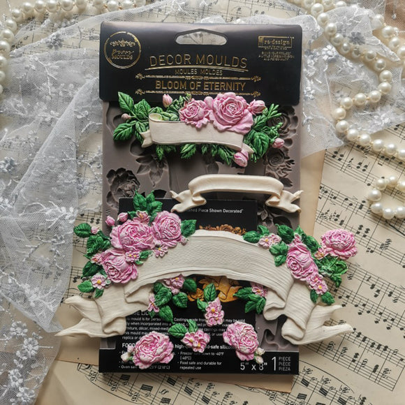 Prima Bloom of Eternity floral banner silicone mold shown with pink rose castings, lace, pearls and vintage sheet music