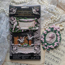 Finished Ombres Florales silicone mold castings with painted cherubs, floral cameo frame, vintage banner trim and ReDesign with Prima packaging