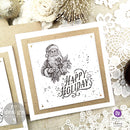 A square corkboard decor created by Tanya Cloete features stamps of Santa and the word Happy Holidays created by using ReDesign with Prima's Santas Helper Tags clear decor stamps.