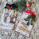Two Christmas themed gift tags created by using ReDesign with Prima's Christmas Chipboard Tags also feature ReDesign with Prima's Twinkle Paws and Nutcracker Magic silicone mold castings.
