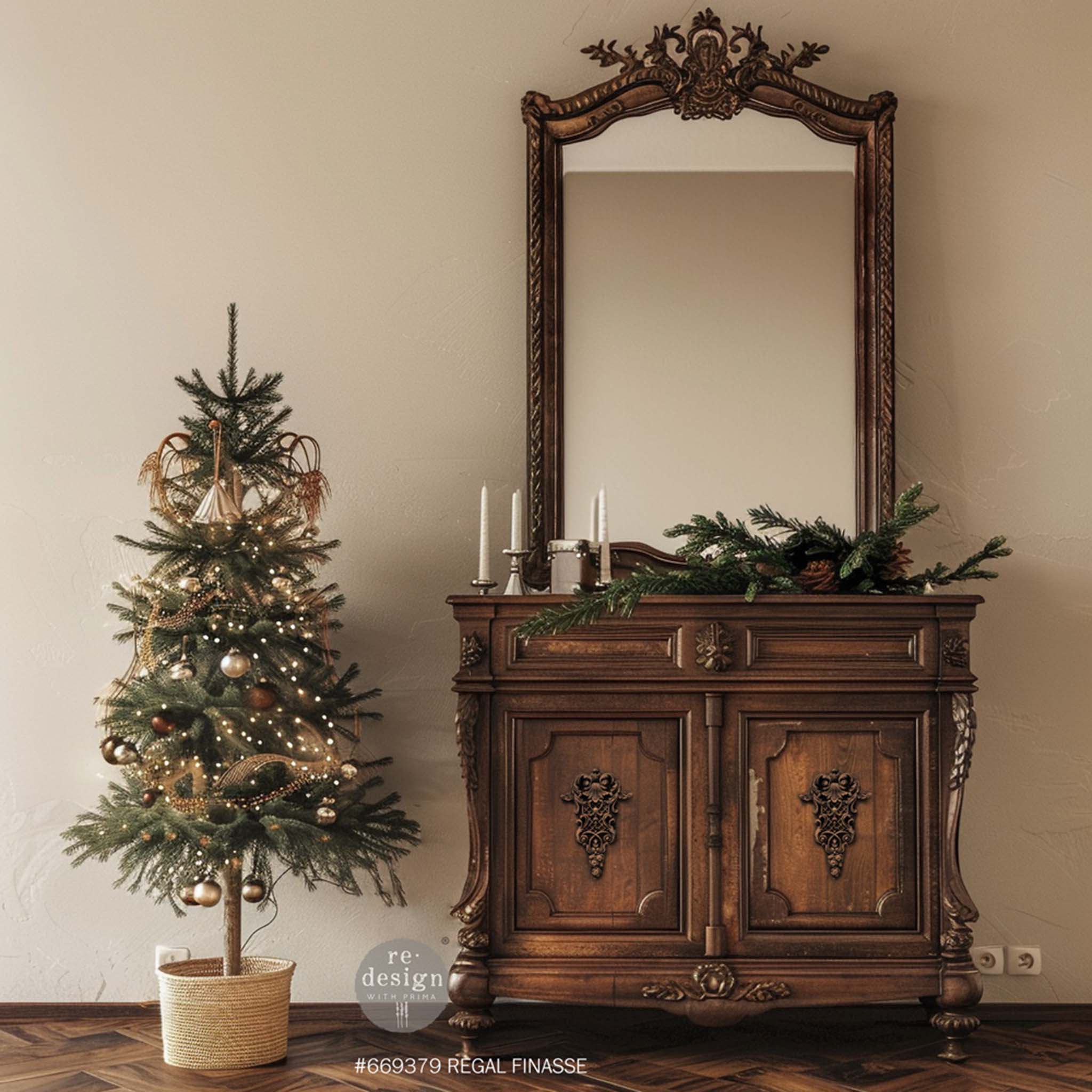 A vintage 2 door console cabinet with a large mirror is natural wood and features ReDesign with Prima's Regal Finasse Decor Poly Casting in the center of its 2 doors.