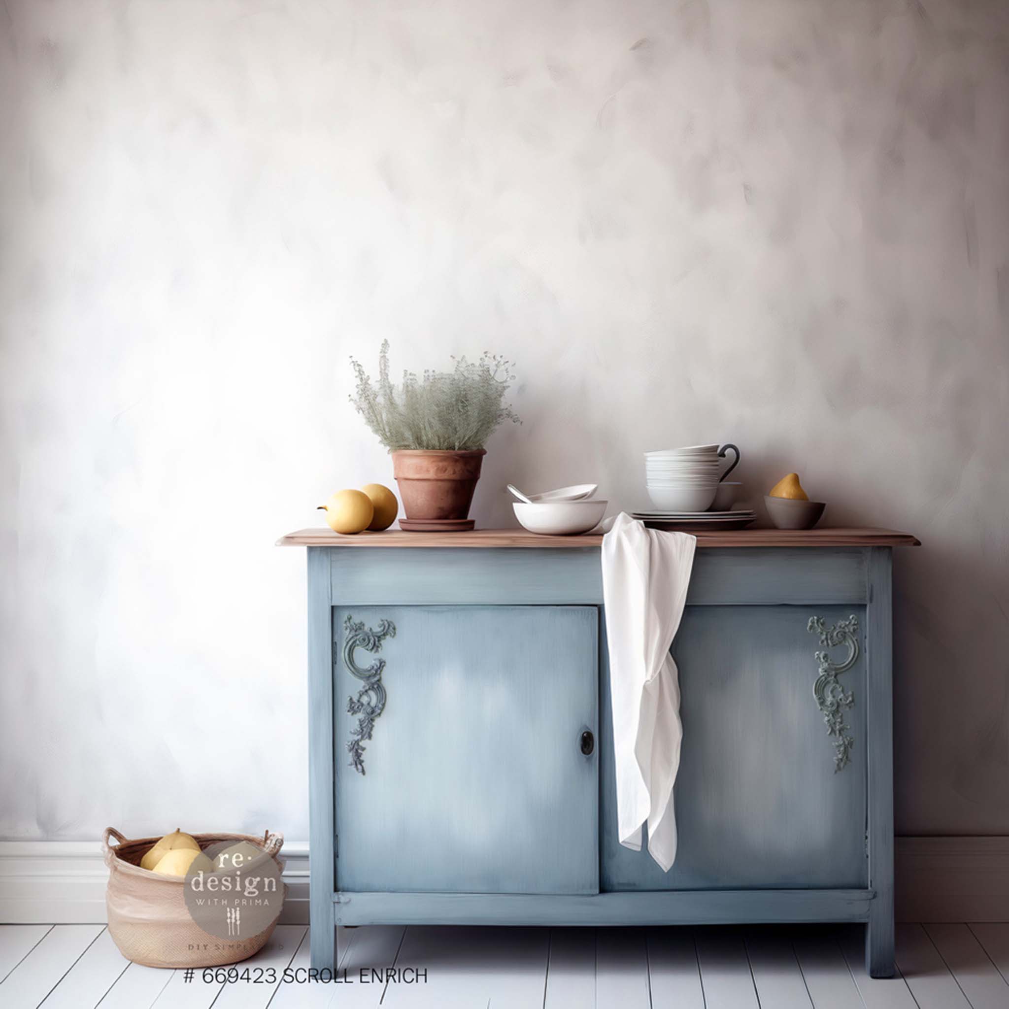 A small buffet table is painted light blue and features ReDesign with Prima's Scroll Enrich Decor Poly Casting on the outer top corners of its 2 doors.