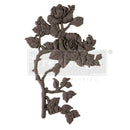 A flexible decor poly casting featuring a thorned branch of 2 roses with leaves facing left is against a white background. 