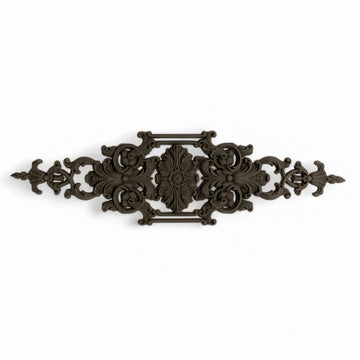 A bendable furniture applique that features scrolling flourishes is against a white background.