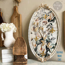An oval decor tray refurbished by Salvage Made Chic features ReDesign with Prima's Petals in Harmony Decor Poly applique painted white over a floral rub-on transfer.