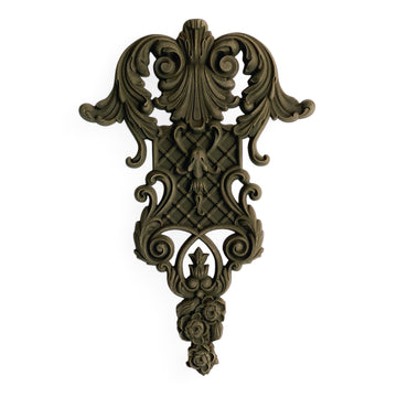 A bendable furniture applique that features intricate flourishes, a lattice center, and floral accents is against a white background.