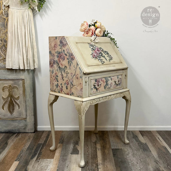 A vintage secretary's desk is painted light beige and features ReDesign with Prima's Velvet Cascade (Left) bendable poly decor on the front of its drop down door.