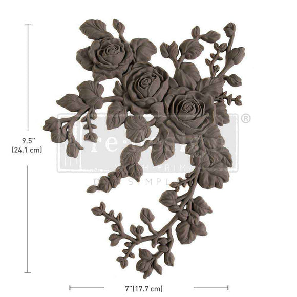 A flexible decor poly casting featuring 3 roses with hanging branches curving to the right is against a white background. Measurements for the casting read: 9.5" (24.1 cm) by 7" (17.7 cm).