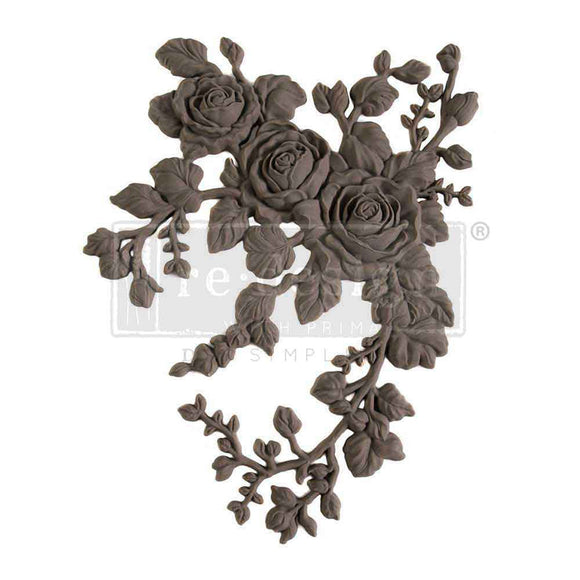 A flexible decor poly casting featuring 3 roses with hanging branches curving to the right is against a white background. 