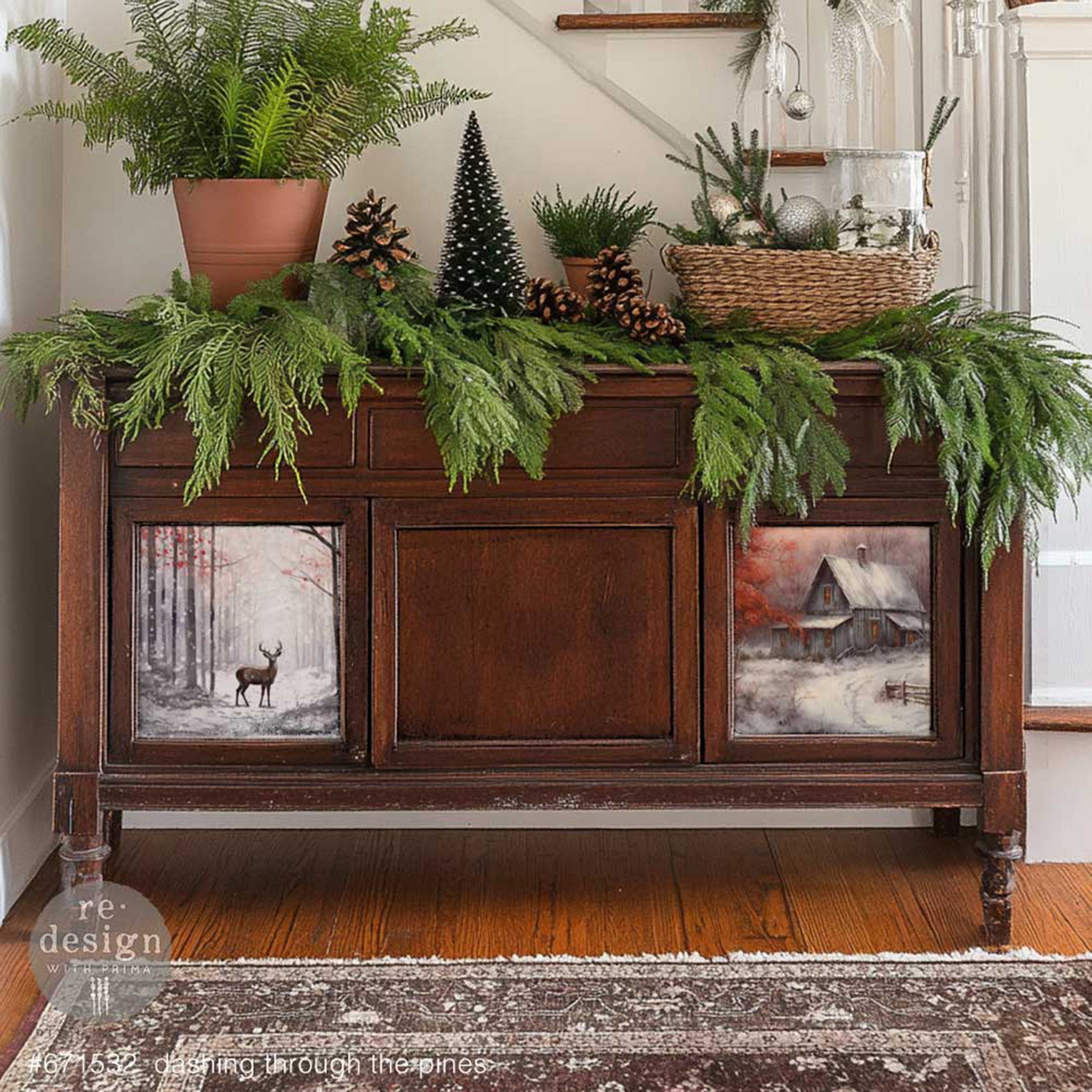 A vintage buffet cabinet is a natural dark wood and features 2 designs from ReDesign with Prima's Dashing Through the Pines A3 fiber papers on it.