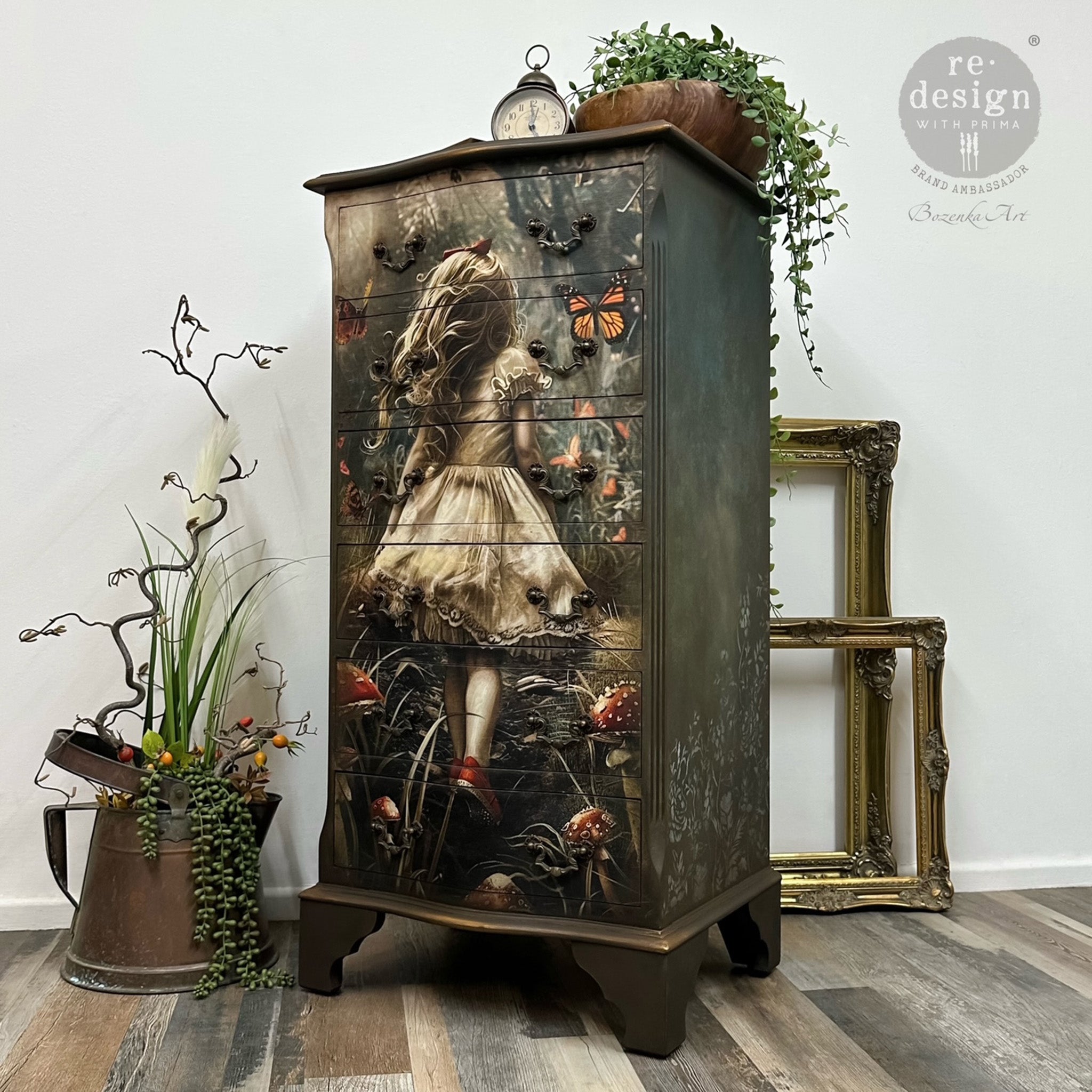 A 4-drawer chest dresser is painted in shades of dark green-brown and features ReDesign with Prima's Dreamlike Trails A1 fiber paper on the front.