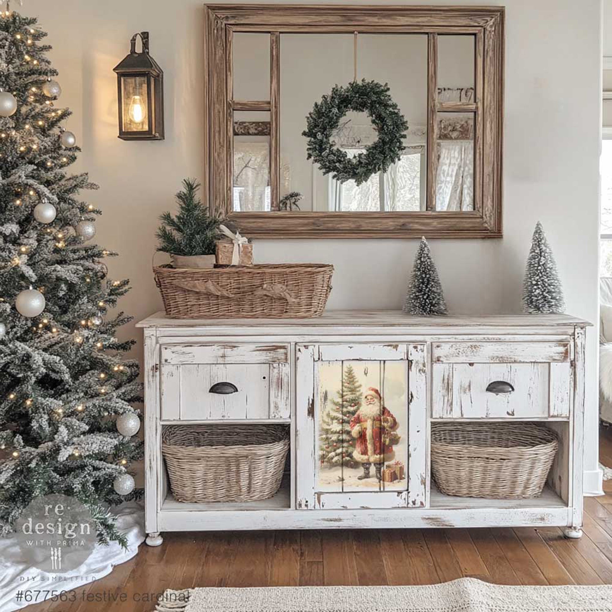 A vintage buffet table is painted a distressed white and features a design from ReDesign with Prima's Festive Cardinal A3 fiber paper on its center door.