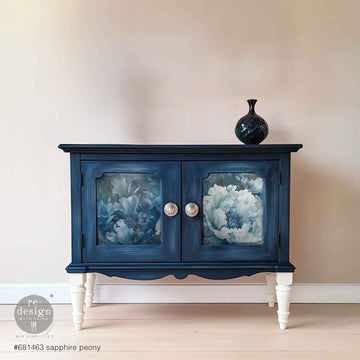 Navy blue cabinet with Sapphire Peony decoupage paper on the door panels, featuring blue-and-white peony florals.
