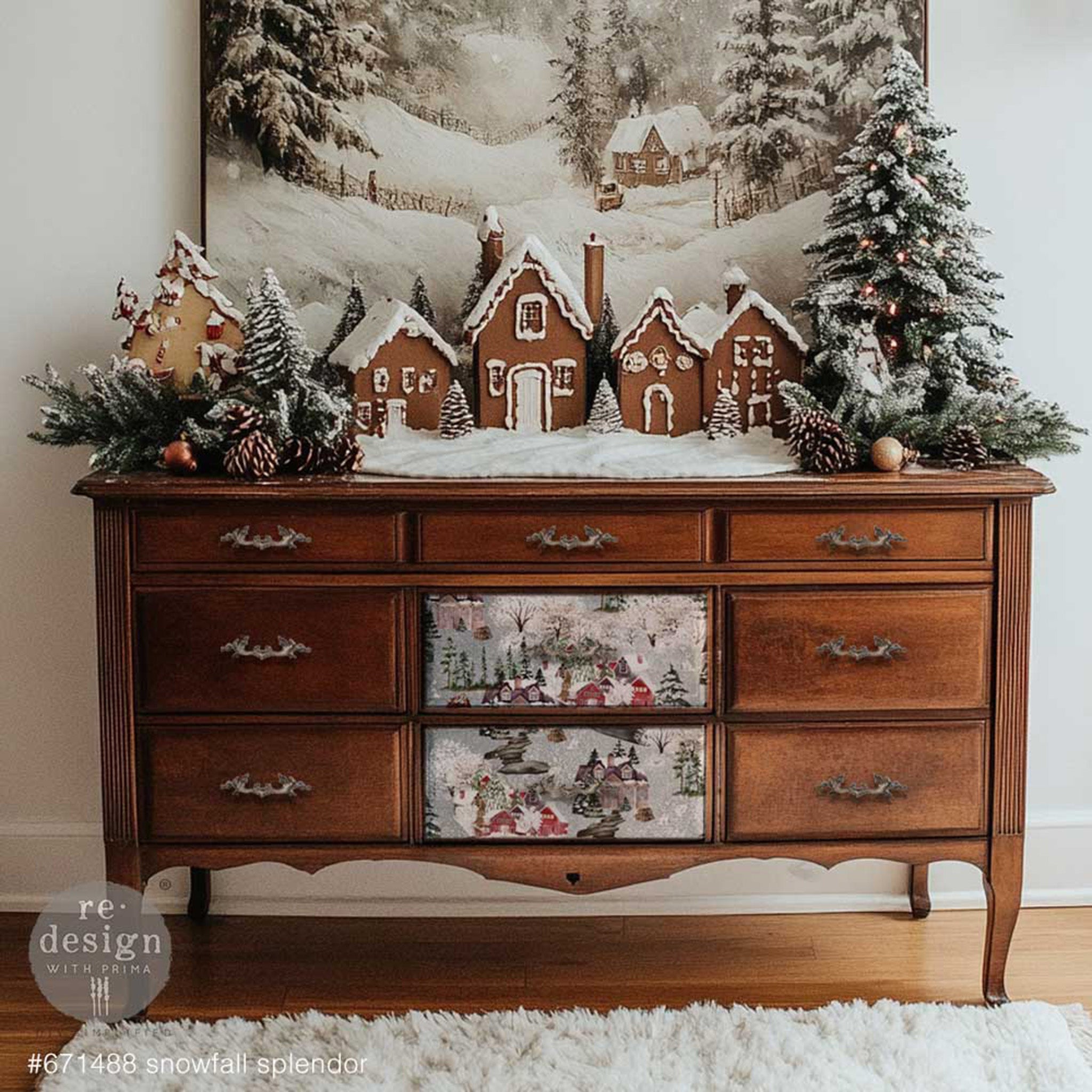 A large 9-drwer dresser has natural wood and features a design from ReDesign with Prima's Snowfall Splendor A3 fiber papers on its 2 bottom center drawers.