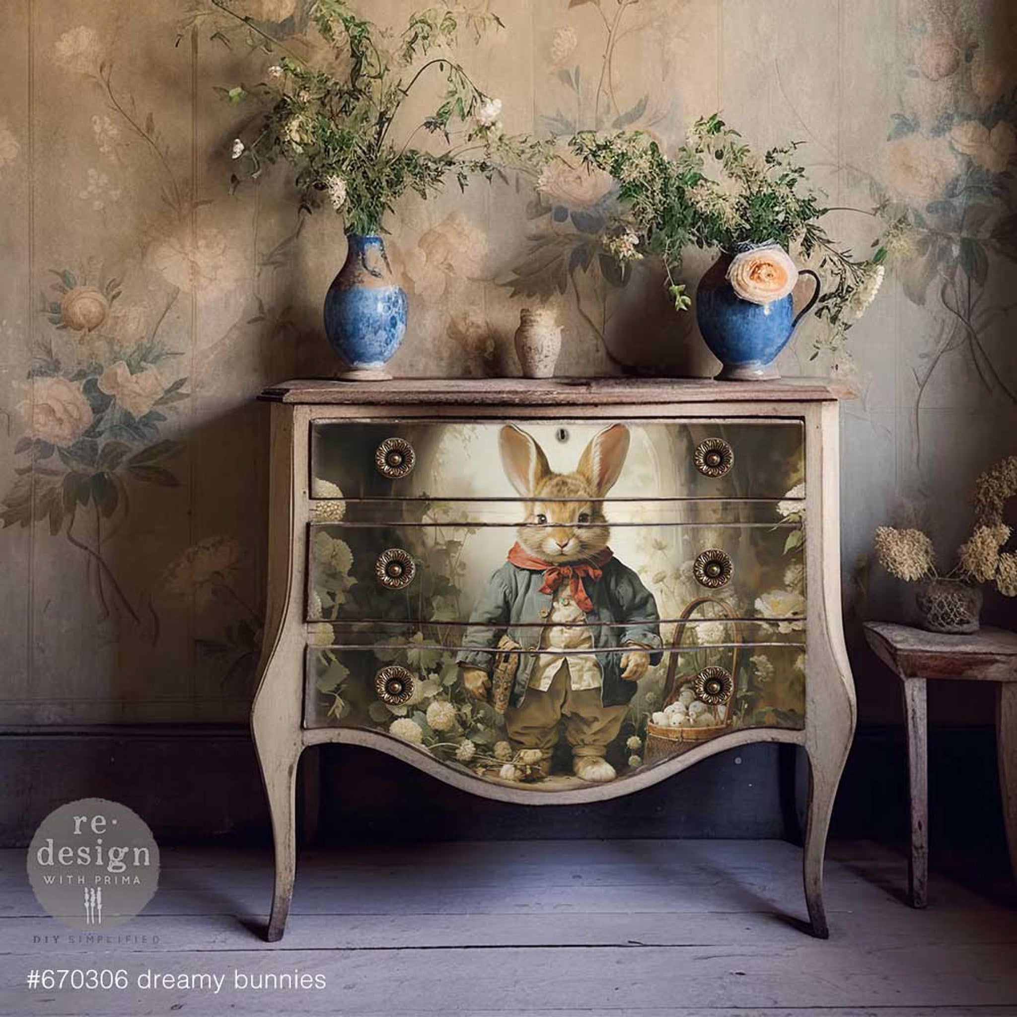 A vintage dresser is painted light beige and features 1 design from ReDesign with Prima's Dreamy Bunnies tissue paper in the center of its drawers.