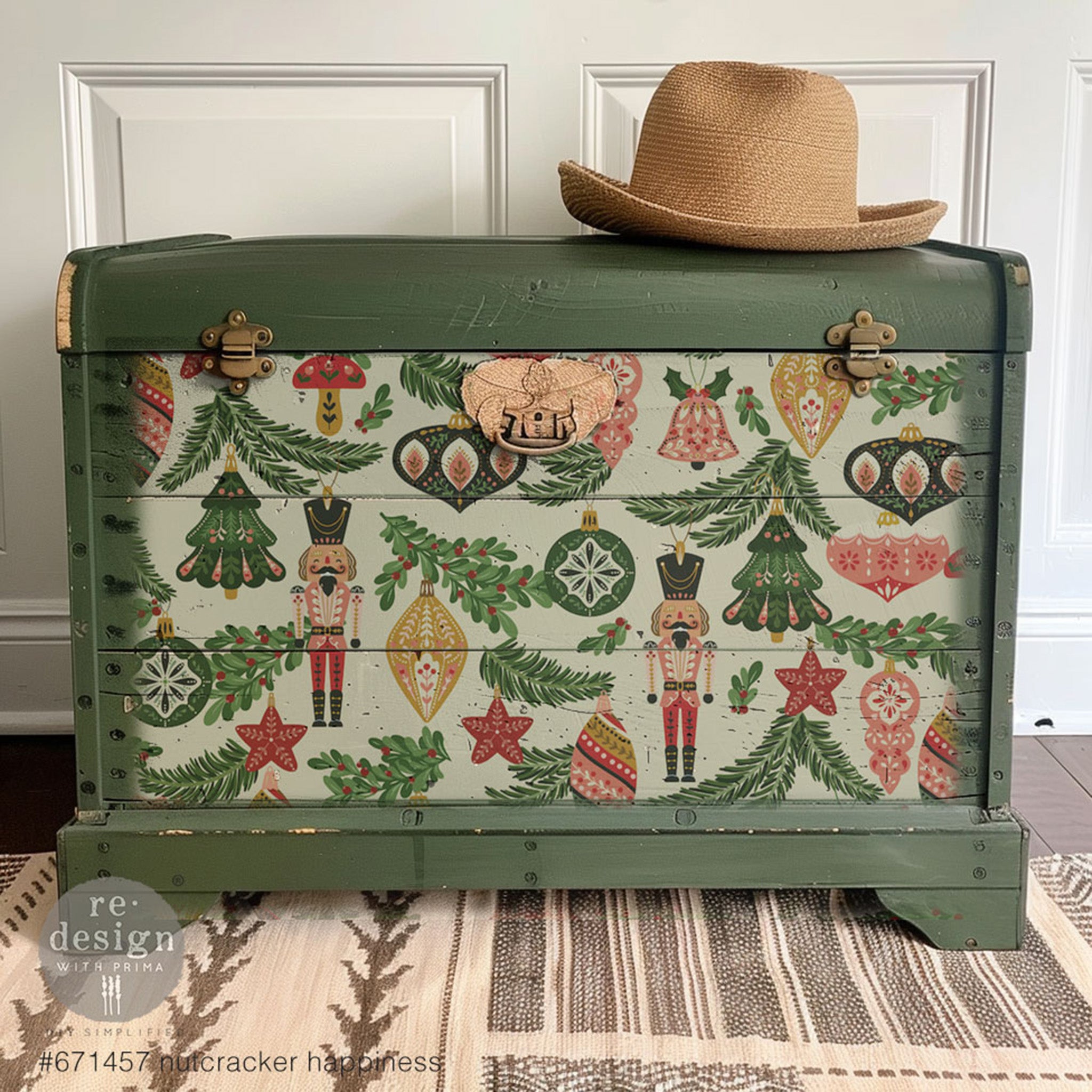 A small wood chest is painted olive green and features 1 of ReDesign with Prima's Nutcracker Happiness fiber papers on the front.