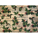 One sheet of an A3 fiber paper featuring holly berries against parchments of sheet music is against a white background.