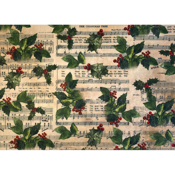 One sheet of an A3 fiber paper featuring holly berries against parchments of sheet music is against a white background.