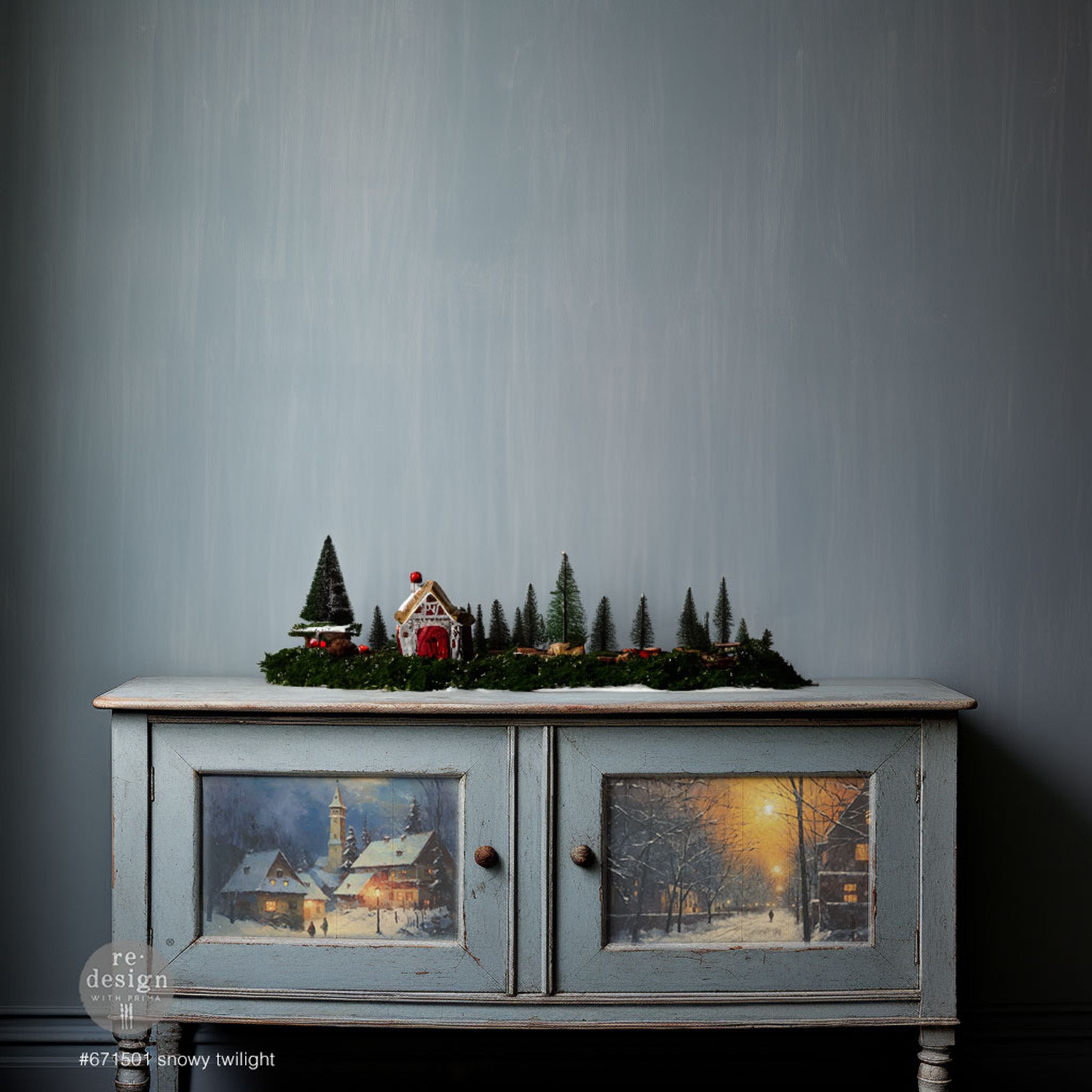 A vintage console table is painted light grey and features ReDesign with Prima's Snowy Twilight fiber paper on its 2 door inlays.