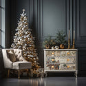A vintage dresser is painted a soft white and features ReDesign with Prima's Holly Jolly Hideaway tissue papers on its drawers. A large white and gold Christmas tree is to the left with a cream colored tufted sitting chair sitting on front of it.