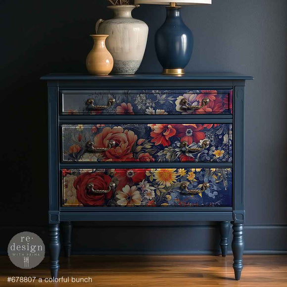 Floral-patterned dresser with decorative vases on a dark background