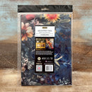 Floral decoupage fiber packaging on a textured wooden surface