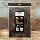 Packaging of Decoupage Fiber on a textured wooden surface