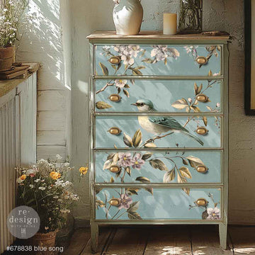 A 5-drawer chest dresser features ReDesign with Prima's Blue Song A1 fiber paper on the drawers.