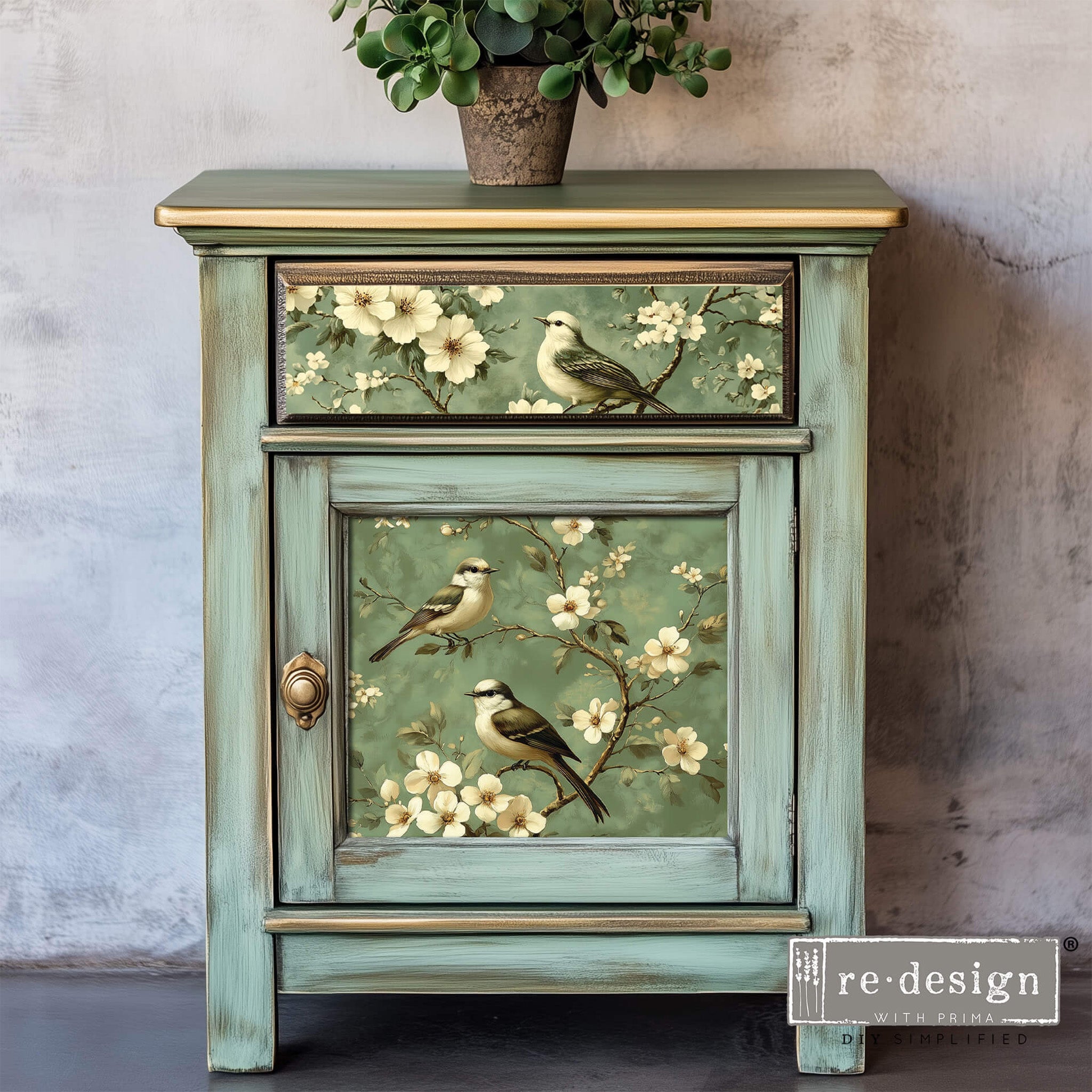 A vintage nightstand with storage  features ReDesign with Prima's Chirping Bliss A3 fiber paper on its drawer and door.