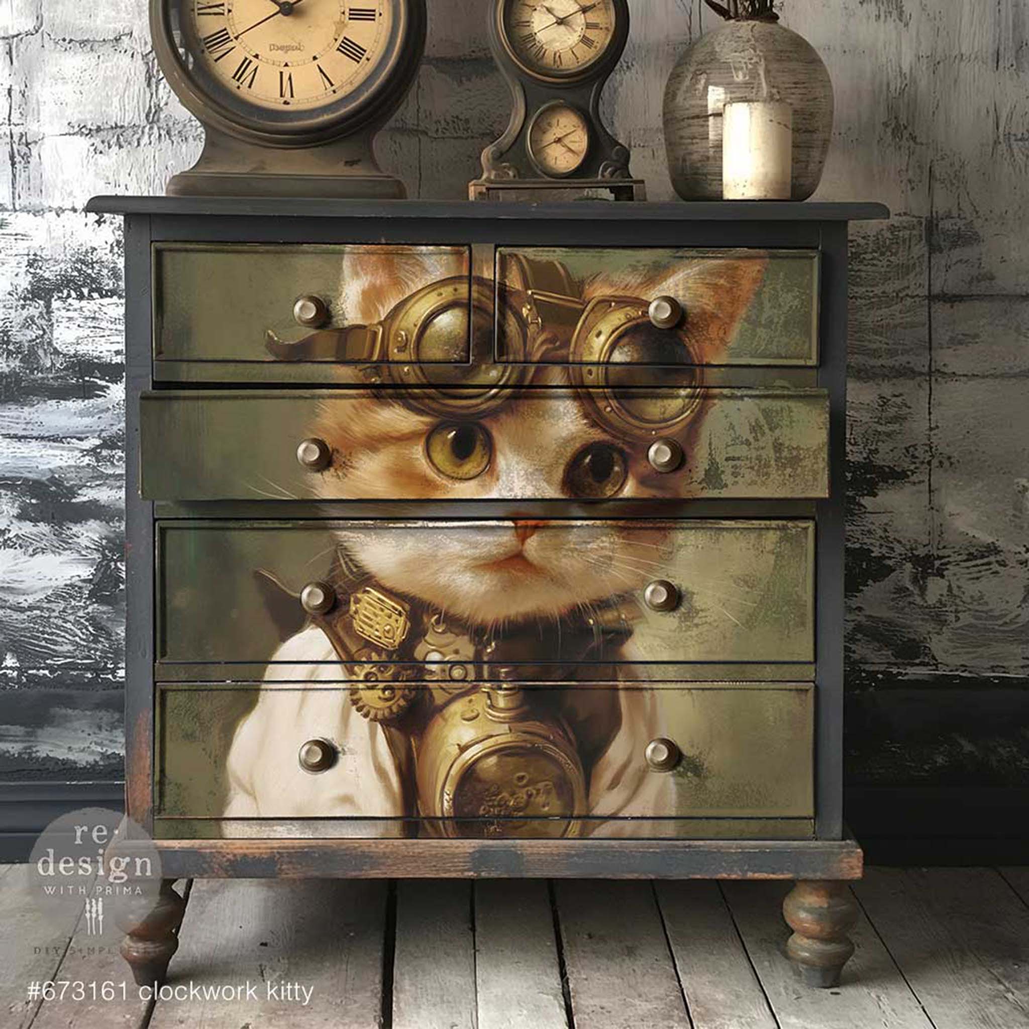 A vintage 5-drawer dresser is painted dark gray and features ReDesign with Prima's Clockwork Kitty A1 fiber paper on the drawers.