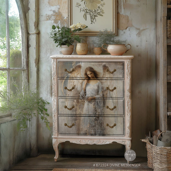 A vintage 4-drawer chest dresser is painted soft white and features ReDesign with Prima's Divine Messenger A1fiber paper on the drawers.