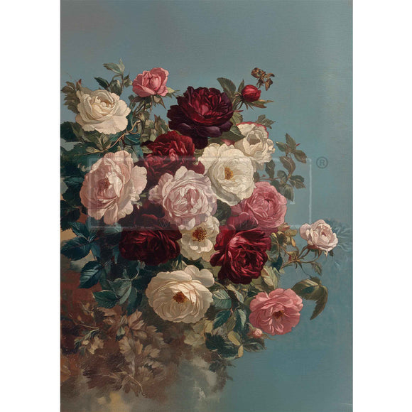 Floral arrangement with red, white, and pink roses on a blue background
