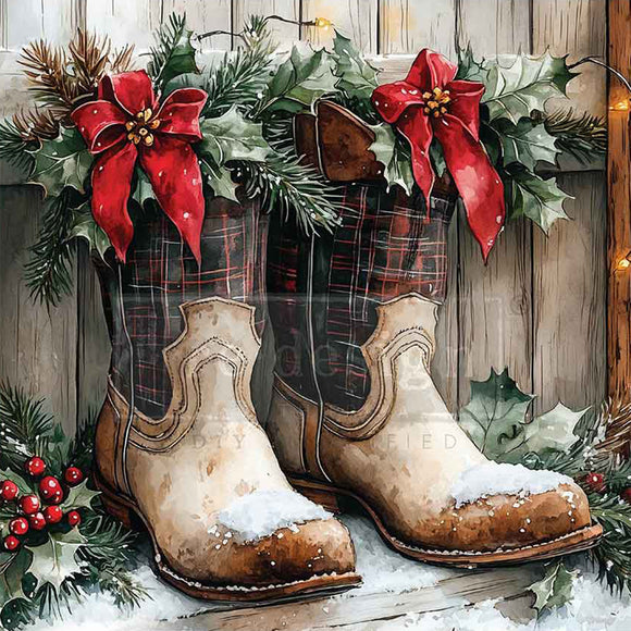 Decorative Christmas scene with cowboy boots, and festive greenery on a wooden background.