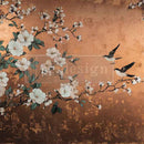 Close-up of an A1 fiber paper that features birds perched among white-flowered branches set against a warm copper background.