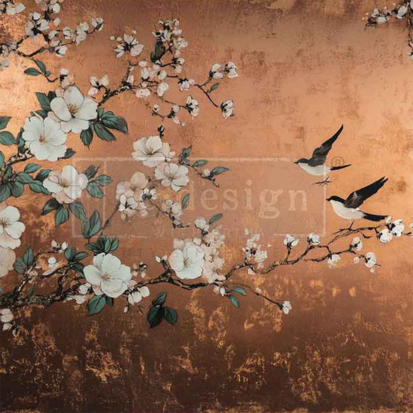 Close-up of an A1 fiber paper that features birds perched among white-flowered branches set against a warm copper background.