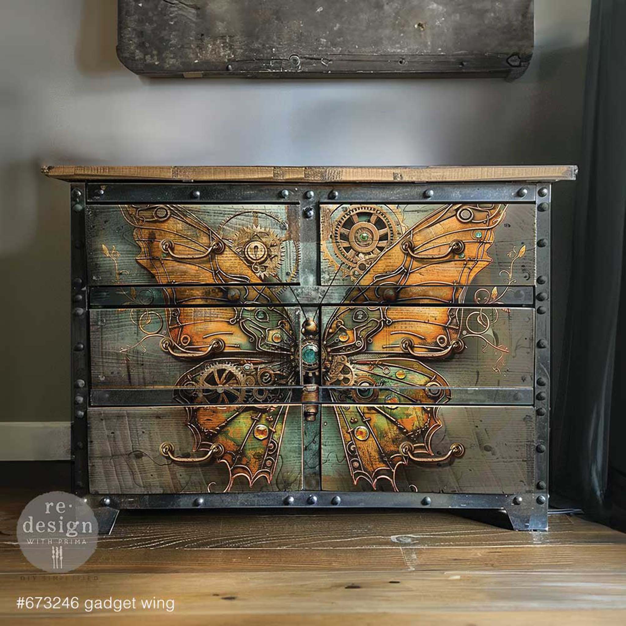 A 6-drawer dresser with an industrial painted look features ReDesign with Prima's Gadget Wing A1 fiber paper on the front.