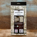 A package of ReDesign with Prima's Kacha Chasing Petals Fiber Paper is against a wood background.