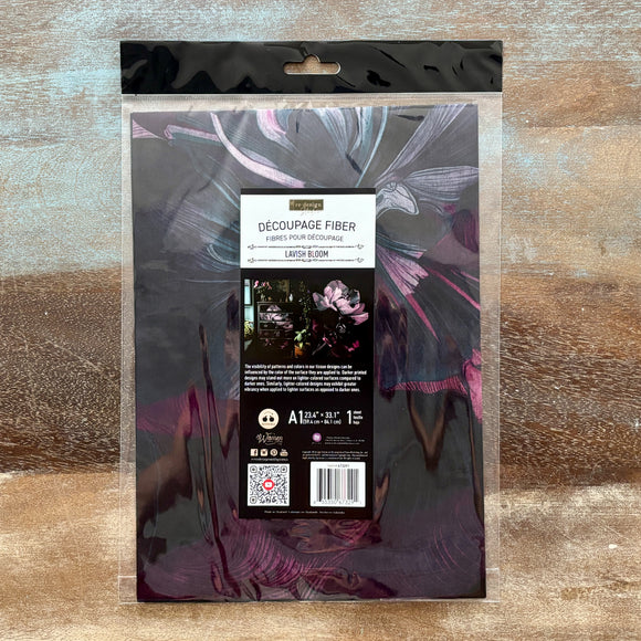 Packaged decoupage fiber material with a decorative design on a wooden surface