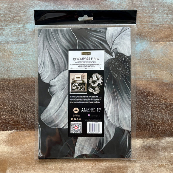 Packaged decoupage fiber with floral design on a wooden surface