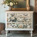 A vintage 3-drawer dresser is painted soft white and features ReDesign with Prima's My Garden Whimsy Fiber paper on the drawers.