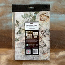 A package of ReDesign with Prima's My Garden Whimsy Fiber Paper is against a wood background.