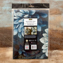 Packaging of decoupage fiber with floral design on a wooden surface