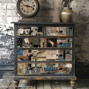 A 5-drawer chest dresser is painted grey and features ReDesign with Prima's Mystic Manuscript fiber paper on the drawers.