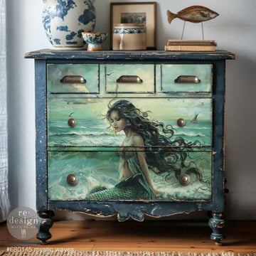 Decorative chest of drawers with a mermaid design.