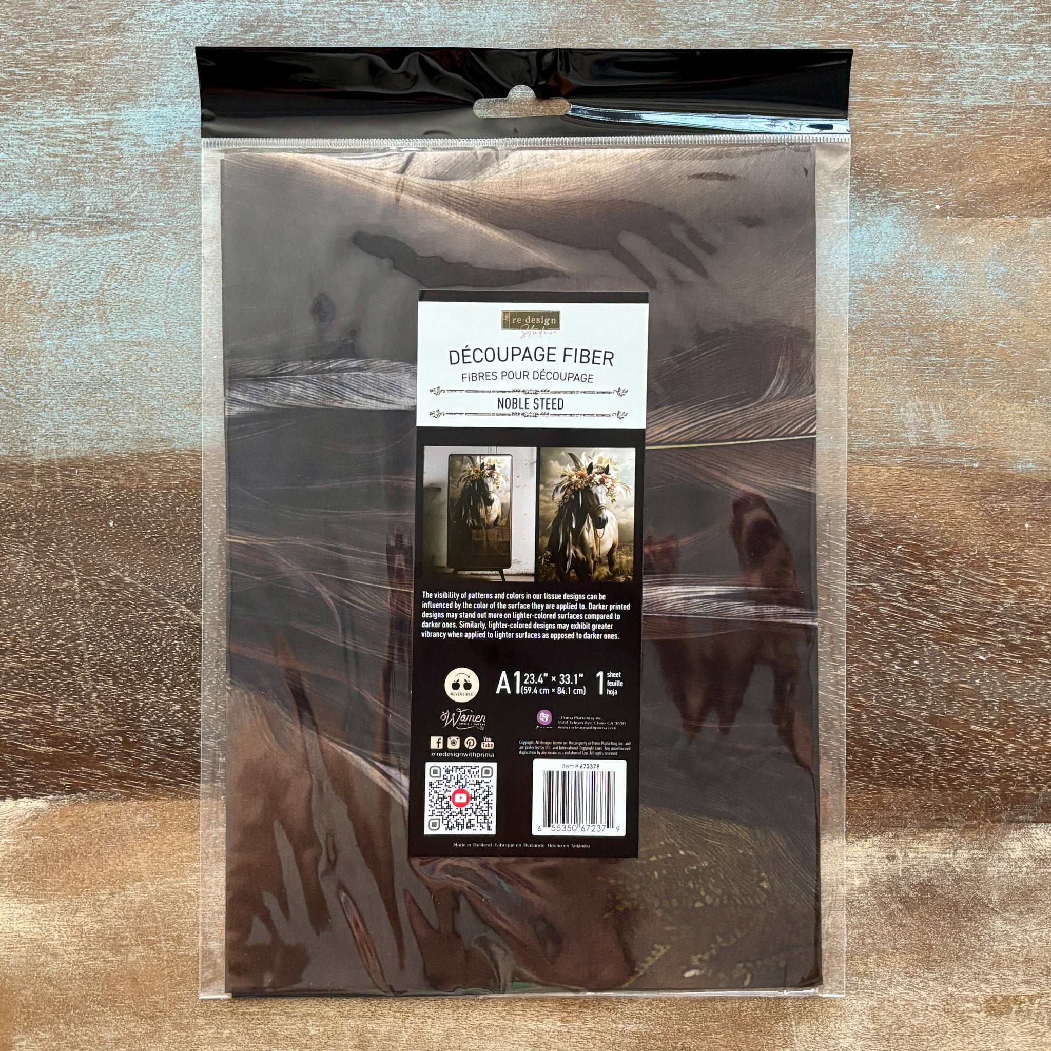 Packaged decoupage fiber on a textured wooden surface