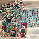 Three sheets of A3 fiber papers that feature vintage Christmas designs of nutcrackers and ornaments area against a light wood background. 
