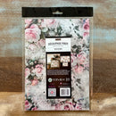 A package of ReDesign with Prima's Rosy Reverie Fiber Paper is against a wood background.