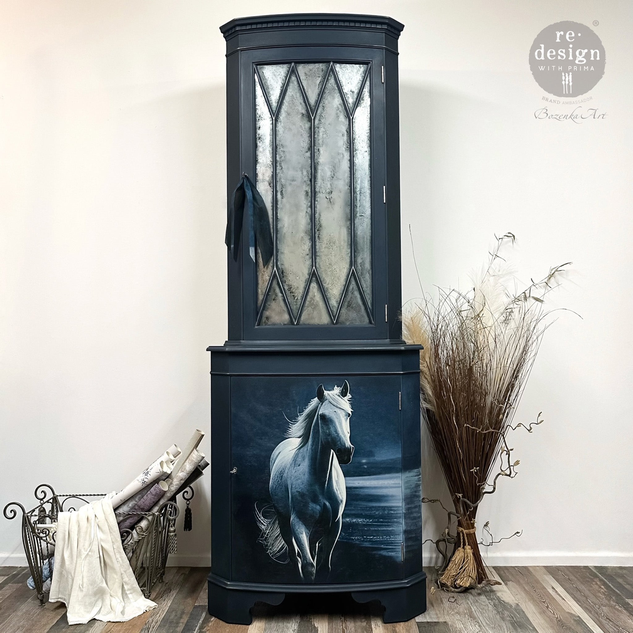 A small hutch cabinet refurbished by Bozenka Art is painted navy blue and features ReDesign with Prima's Seashore Sprinter fiber paper on its bottom door.