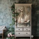 Vintage-style cabinet with swan design on a textured wall background